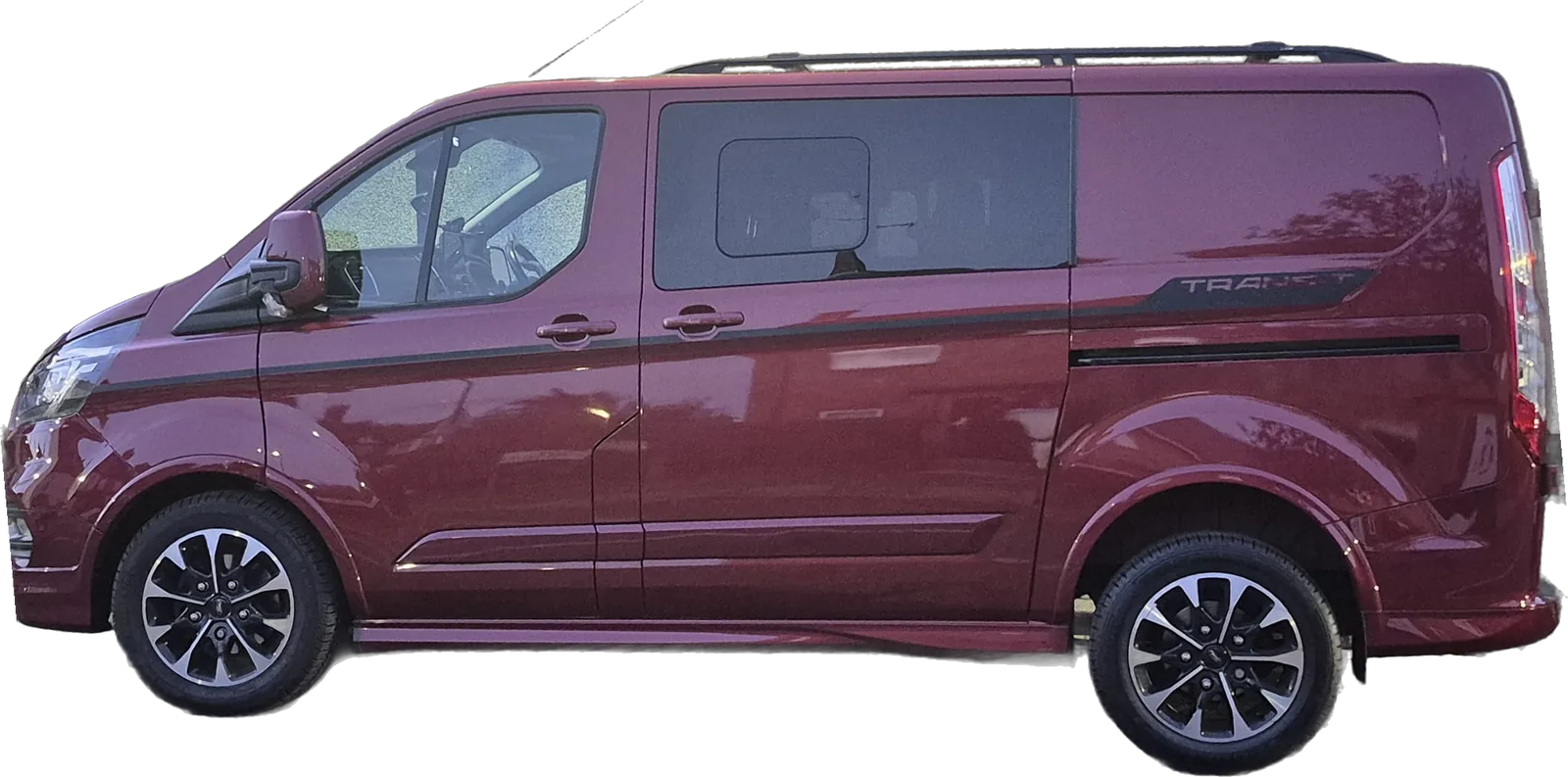 Side view of the Othalias crew van showing the passenger windows and rear cargo area
